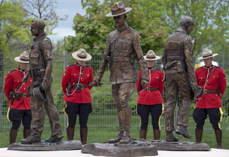 A bronze monument featuring life-size statues of Constables Doug Larche, Dave Ross and Fabrice Gevaudan, who were gunned down in Moncton, N.B., in 2014