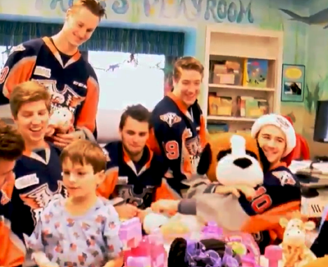 Flint Firebirds players bring stuffed toy animals to sick kids clinic